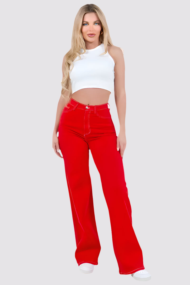 Woman wearing a white sleeveless top and red pants on a white background