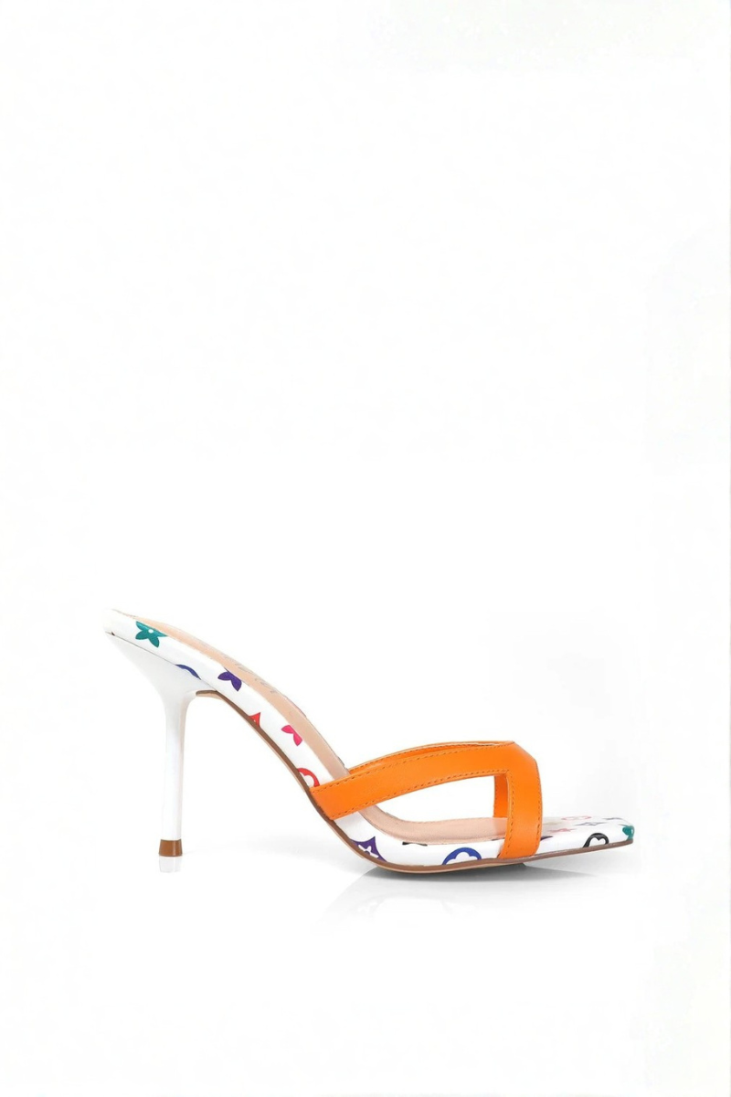 High-heeled shoe with orange strap and multicolored pattern on white background
