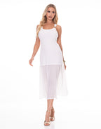 Woman wearing a white sleeveless dress with sheer overlay on a white background