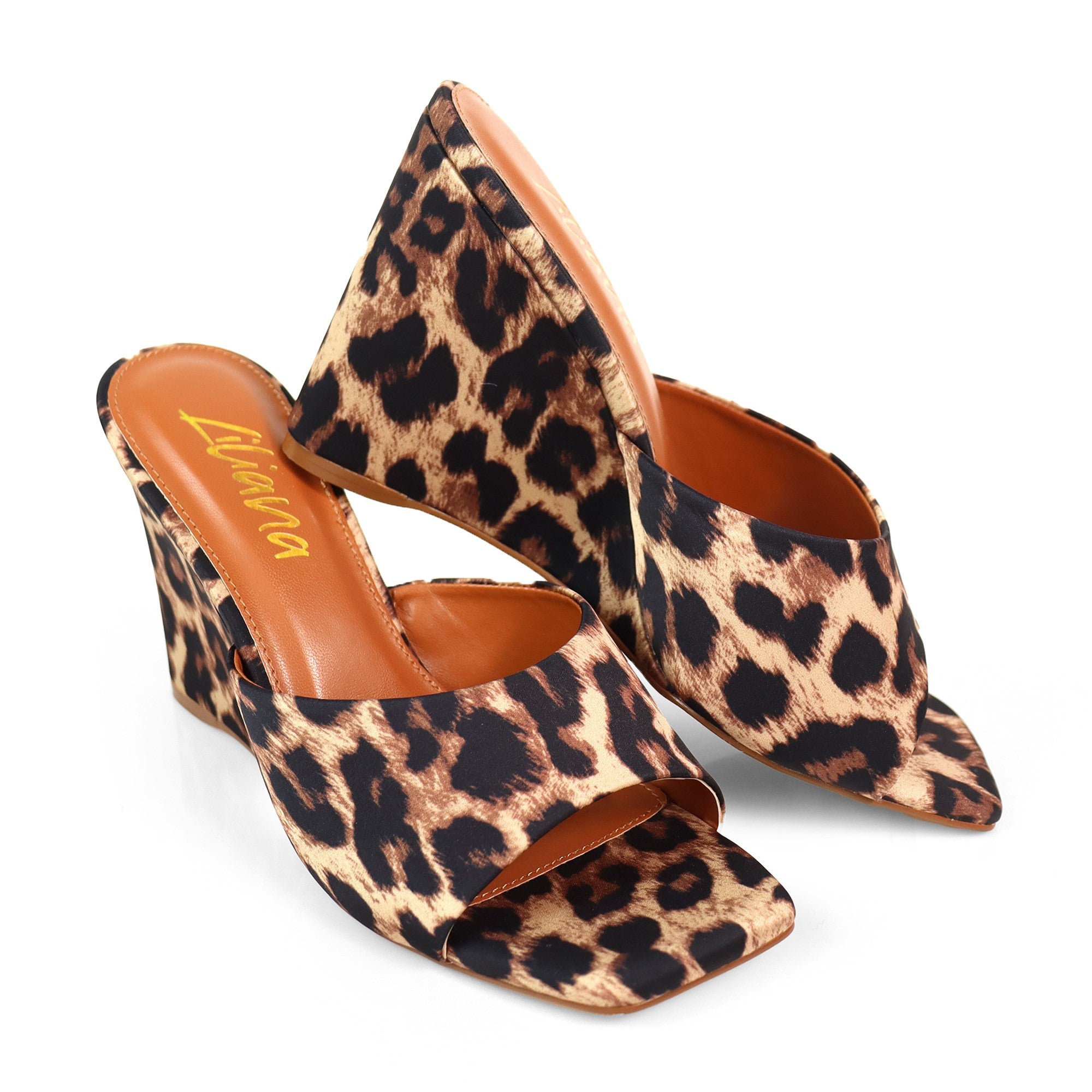 Leopard print high-heeled wedge sandals on a white background