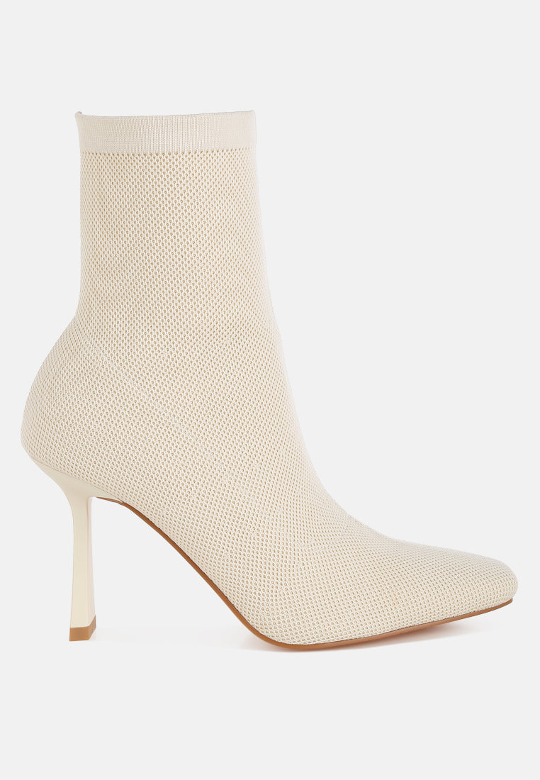 Beige sock boot on a white background