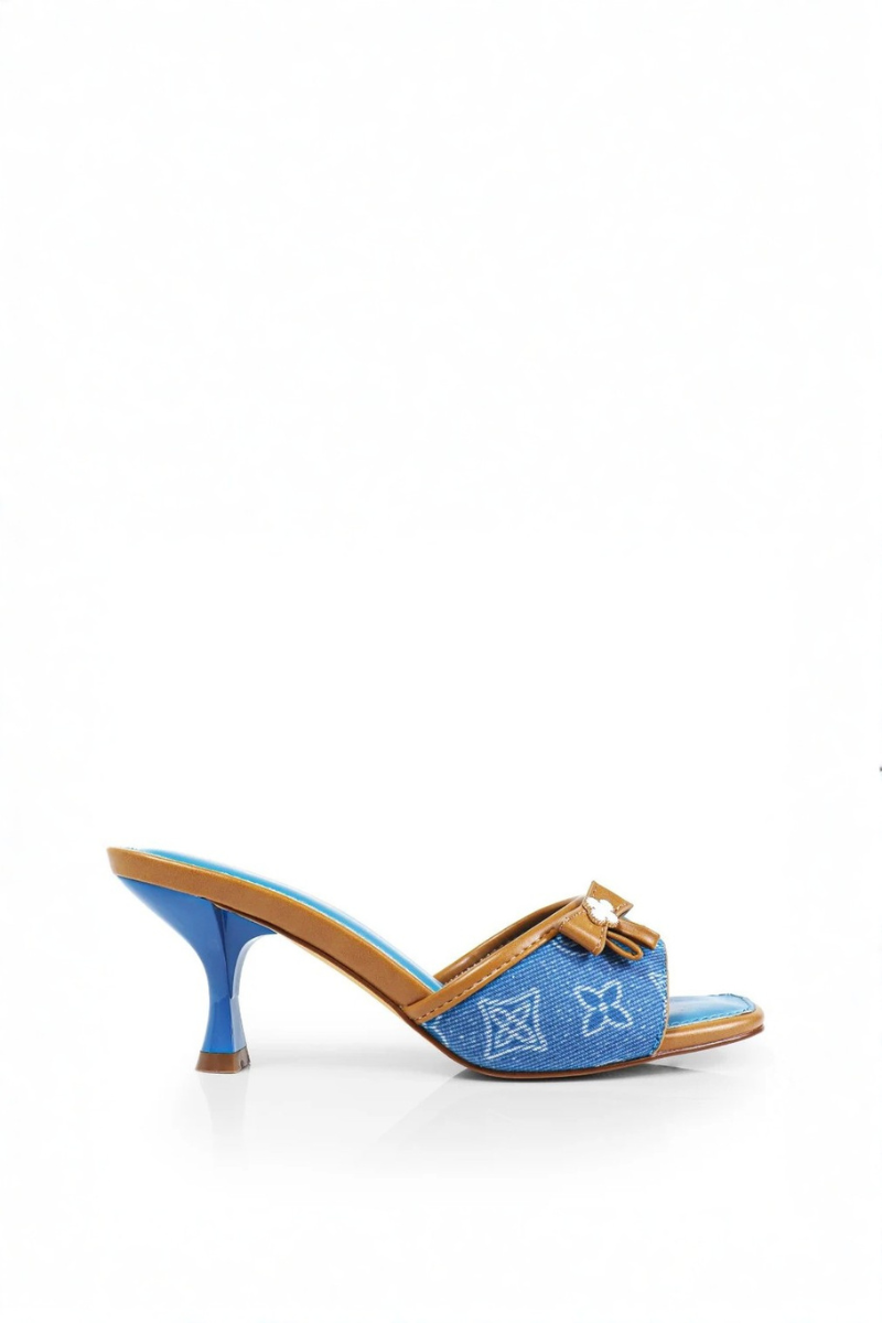 Blue high-heeled shoe with brown bow on a white background